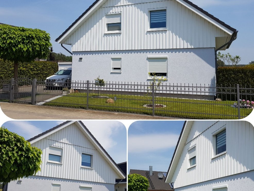 Rollladen mit weißen Rolladenpanzern an zweigeteilter Fassade